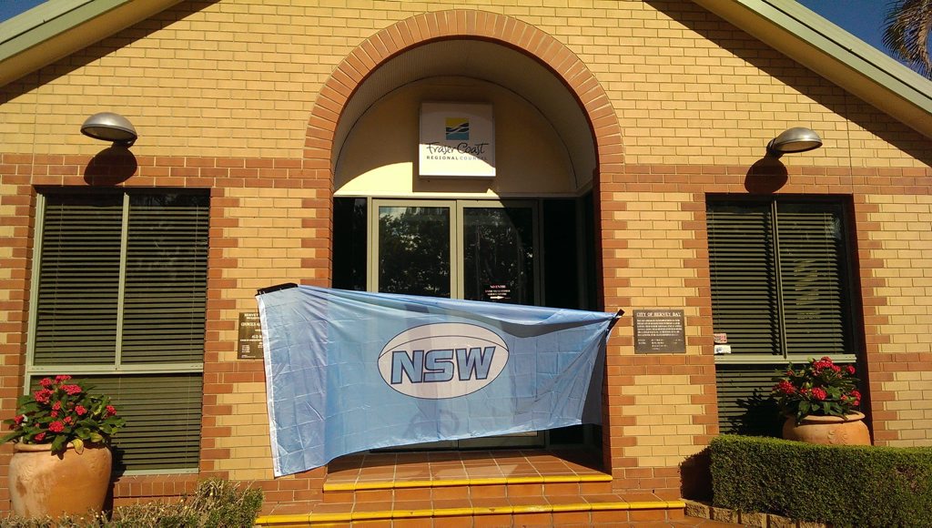 Hervey Bay's Glen Chapman celebrated the New South Wales State of Origin win by draping the blues flag across the entrance to the council headquarters in Tavistock St. Hervey Bay's Glen Chapman celebrated the New South Wales State of Origin win by draping the blues flag across the entrance to the council headquarters in Tavistock St.